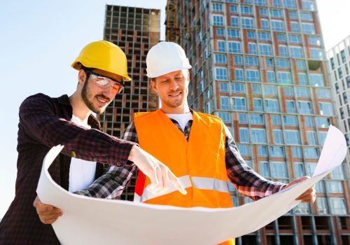 medium-shot-low-angle-view-engineer-architect-supervising-construction1